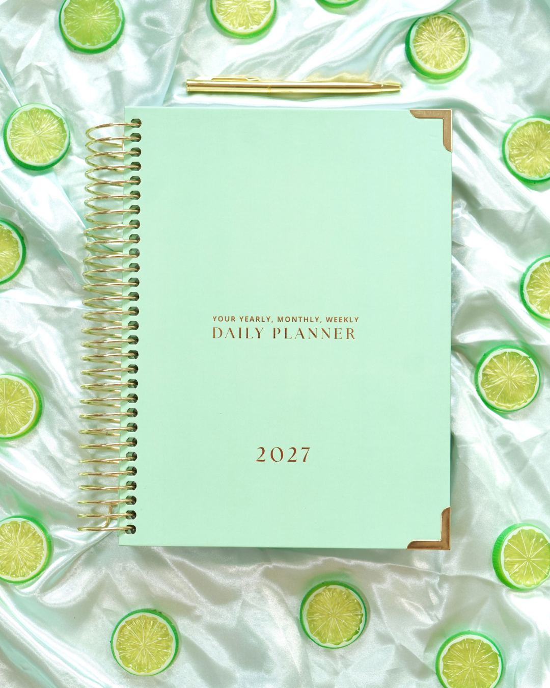 Mint green 2027 Daily Spiral Planner with gold spiral binding and lime slices