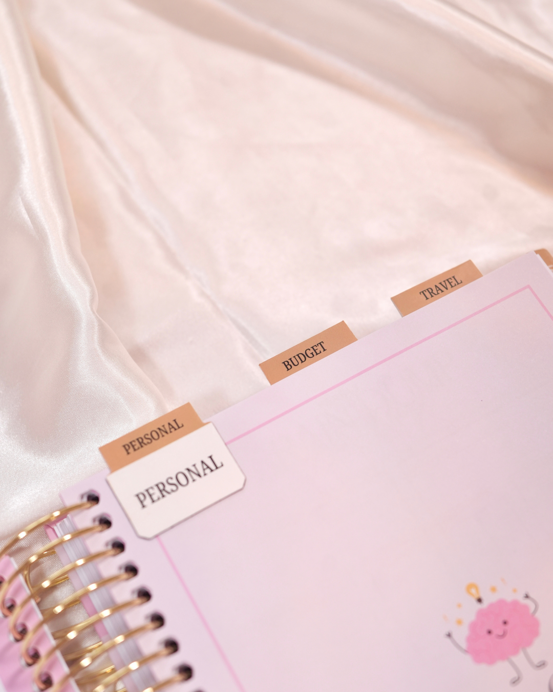 Personal, Budget, and Travel magnetic tabs on a planner page